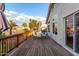 Large back deck features a dining table and chairs and overlooks neighboring properties at 930 W Hudson Way, Gilbert, AZ 85233