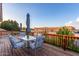 Open back deck featuring an outdoor dining set under an umbrella with scenic neighborhood views at 930 W Hudson Way, Gilbert, AZ 85233