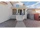 A covered front porch has elegant railings and stairs leading to the entryway at 930 W Hudson Way, Gilbert, AZ 85233