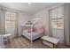 Playful bedroom with house frame bed, natural light, and neutral carpet at 9918 E Tahoe Ave, Mesa, AZ 85212