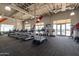 Well-equipped fitness center with modern treadmills, weights, and large windows for natural light and community views at 9918 E Tahoe Ave, Mesa, AZ 85212