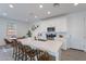 Bright and airy kitchen featuring white cabinets, stainless steel appliances, and an island with seating at 9918 E Tahoe Ave, Mesa, AZ 85212