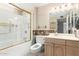 Bathroom featuring a tub with gold trim at 9946 W Willow Creek Cir, Sun City, AZ 85373