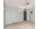 Carpeted bedroom featuring two doors and a ceiling fan at 9946 W Willow Creek Cir, Sun City, AZ 85373