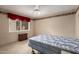 Bedroom with a window and carpet floors at 9946 W Willow Creek Cir, Sun City, AZ 85373