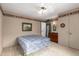 Bedroom featuring neutral walls, patterned border and ceiling fan at 9946 W Willow Creek Cir, Sun City, AZ 85373