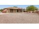 Charming single-story home with a drought-tolerant front yard and inviting covered patio at 9946 W Willow Creek Cir, Sun City, AZ 85373