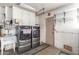 Bright laundry room with a sink and modern appliances at 9946 W Willow Creek Cir, Sun City, AZ 85373