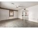 Spacious living room featuring tile flooring and bright natural light at 9946 W Willow Creek Cir, Sun City, AZ 85373