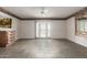 A bright living room with decorative details, tile flooring, and a ceiling fan at 9946 W Willow Creek Cir, Sun City, AZ 85373