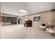 Spacious living room featuring carpet, ample seating, and natural light, creating a comfortable atmosphere at 9946 W Willow Creek Cir, Sun City, AZ 85373