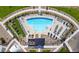 Aerial view of the community pool with lounge chairs and manicured landscaping at 9948 W Piccadilly Rd, Avondale, AZ 85392