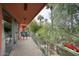 The spacious balcony offers a relaxing outdoor area with seating and views of lush greenery and palm trees at 120 E Coronado Rd # 9, Phoenix, AZ 85004