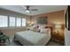 Comfortable bedroom featuring a ceiling fan and plantation shutters at 120 E Coronado Rd # 9, Phoenix, AZ 85004