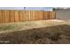 Spacious backyard featuring a secure wood fence and block wall, ready for outdoor enjoyment and relaxation at 1210 E Marny Rd, Tempe, AZ 85288