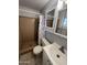 Bathroom with tile shower and vanity that offers storage and functionality at 1210 E Marny Rd, Tempe, AZ 85288