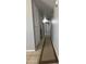 Clean, neutral-toned hallway with tile flooring and recessed lighting, creating a bright and inviting space at 1210 E Marny Rd, Tempe, AZ 85288