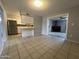 Kitchen and dining area with tile floors and stainless steel appliances at 1210 E Marny Rd, Tempe, AZ 85288