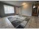 Light filled living room showing neutral paint, and tile floors at 1210 E Marny Rd, Tempe, AZ 85288