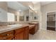 Bathroom with double sinks, granite counters, and a separate vanity at 12852 W El Sueno Dr, Sun City West, AZ 85375