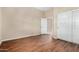 Bedroom with hardwood floors and sliding door closet at 12852 W El Sueno Dr, Sun City West, AZ 85375