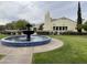 Clubhouse exterior featuring a fountain and well-maintained grounds at 12852 W El Sueno Dr, Sun City West, AZ 85375