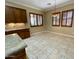 Open-concept dining area featuring tile floors, pendant lighting, and wood-trimmed windows with shutters at 12852 W El Sueno Dr, Sun City West, AZ 85375
