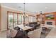 Bright dining room featuring ample natural light, a fireplace, and stylish furnishings at 12852 W El Sueno Dr, Sun City West, AZ 85375