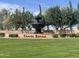 Community entrance with lush landscaping, water feature and attractive signage at 12852 W El Sueno Dr, Sun City West, AZ 85375