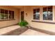 Inviting front porch featuring a decorative planter, tiled flooring, and arched entry at 12852 W El Sueno Dr, Sun City West, AZ 85375