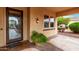 Cozy front porch with decorative planter and welcoming entrance with glass and wood door at 12852 W El Sueno Dr, Sun City West, AZ 85375