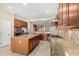 Modern kitchen featuring stainless steel appliances, large island, and granite countertops at 12852 W El Sueno Dr, Sun City West, AZ 85375