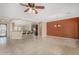 Open-concept living room with a breakfast bar, tile flooring, and neutral paint at 12852 W El Sueno Dr, Sun City West, AZ 85375