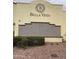 Close-up of the community sign with decorative tile and landscaped grounds at 12852 W El Sueno Dr, Sun City West, AZ 85375