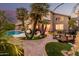 Outdoor patio with landscaping, covered area, and scenic views of the pool at 12955 E Mercer Ln, Scottsdale, AZ 85259