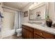 Bathroom featuring tile floors, a granite counter, and a shower/tub combo at 12955 E Mercer Ln, Scottsdale, AZ 85259