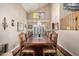 Elegant dining room with vaulted ceiling, long wood table, and ornate chairs at 12955 E Mercer Ln, Scottsdale, AZ 85259