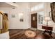 Inviting foyer with hardwood floors, decorative inlays, and a welcoming atmosphere at 12955 E Mercer Ln, Scottsdale, AZ 85259