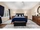 Spacious main bedroom featuring hardwood floors, an area rug, and a king bed at 12955 E Mercer Ln, Scottsdale, AZ 85259