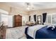 Well-lit main bedroom featuring hardwood floors, an area rug, and vaulted ceilings at 12955 E Mercer Ln, Scottsdale, AZ 85259