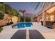 Backyard pool with lounge chairs, lush greenery, and a serene ambiance for relaxation at 12955 E Mercer Ln, Scottsdale, AZ 85259