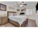 Comfortable bedroom with wood-look floors, a large bed, and natural light from the window at 14446 N 40Th Pl, Phoenix, AZ 85032