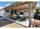 Covered patio with comfortable seating and an outdoor entertainment area for relaxation and enjoyment at 14446 N 40Th Pl, Phoenix, AZ 85032