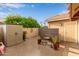 Private backyard space with storage shed, desert plants, and block fence at 1453 E Butler Cir, Chandler, AZ 85225