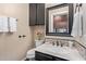 Cozy powder room with vanity, decorative mirror, and neutral decor at 1453 E Butler Cir, Chandler, AZ 85225