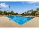 Community pool with lounge chairs and tables, perfect for relaxation and socializing at 1453 E Butler Cir, Chandler, AZ 85225