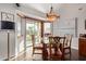 Charming dining area with water view, sliding doors to patio, and decorative chandelier at 1453 E Butler Cir, Chandler, AZ 85225