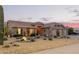 Inviting home featuring a neutral color palette, well-manicured landscaping, and a spacious two-car garage at 1453 E Butler Cir, Chandler, AZ 85225