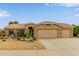 Inviting home featuring a neutral color palette, well-manicured landscaping, and a spacious two-car garage at 1453 E Butler Cir, Chandler, AZ 85225