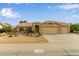 Inviting home featuring a neutral color palette, well-manicured landscaping, and a spacious two-car garage at 1453 E Butler Cir, Chandler, AZ 85225